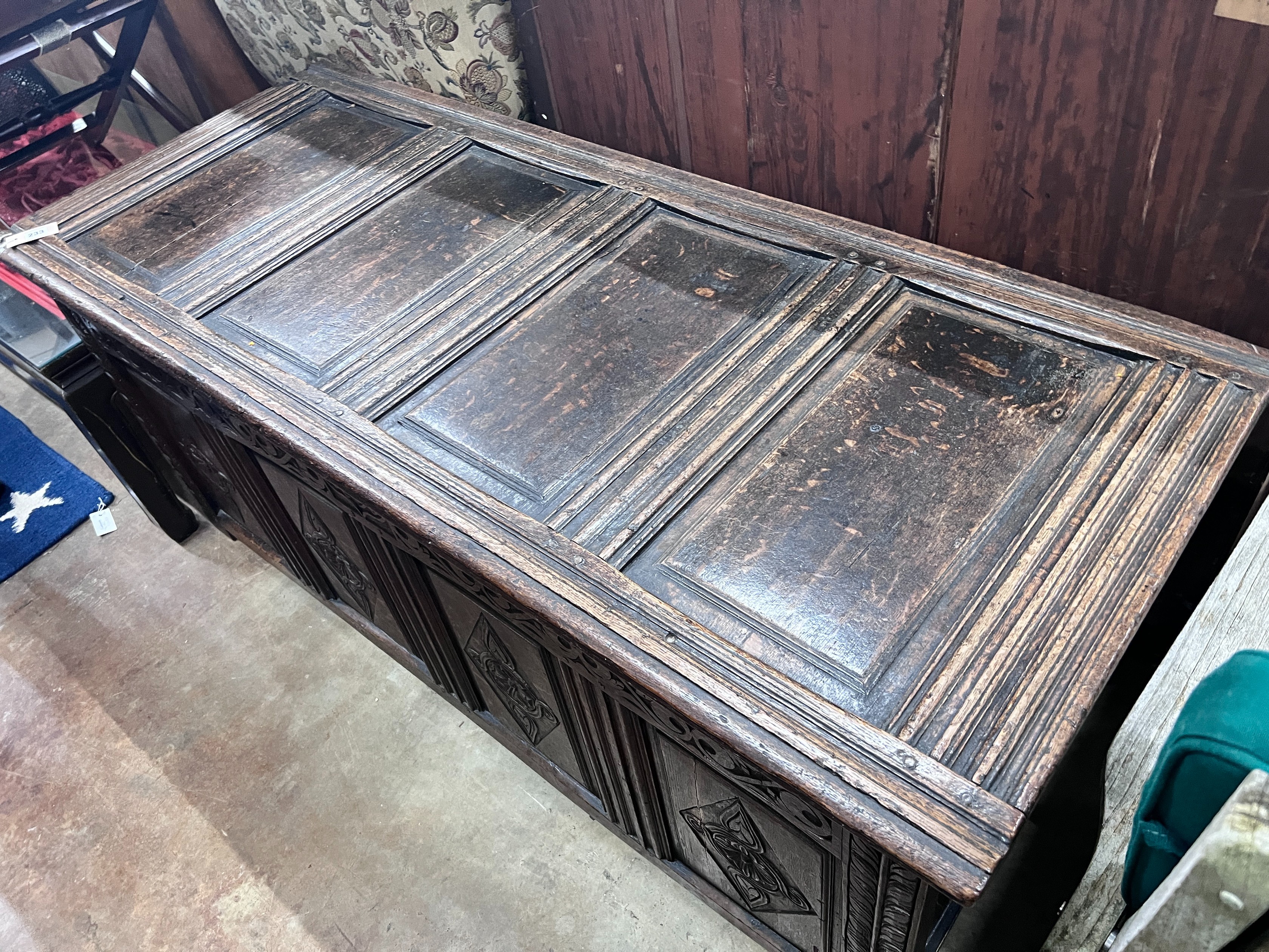 An early 18th century panelled oak coffer, width 154cm *Please note the sale commences at 9am.
